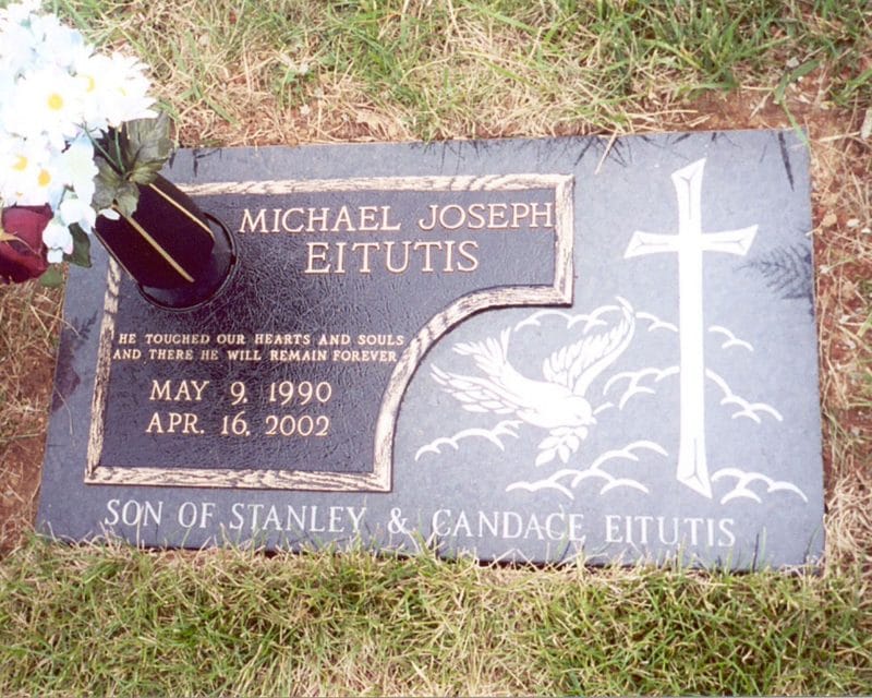 Eitutis Bronze Flat Marker on Granite with Bird and Cross